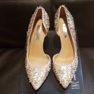 Karlay gold floral pumps.